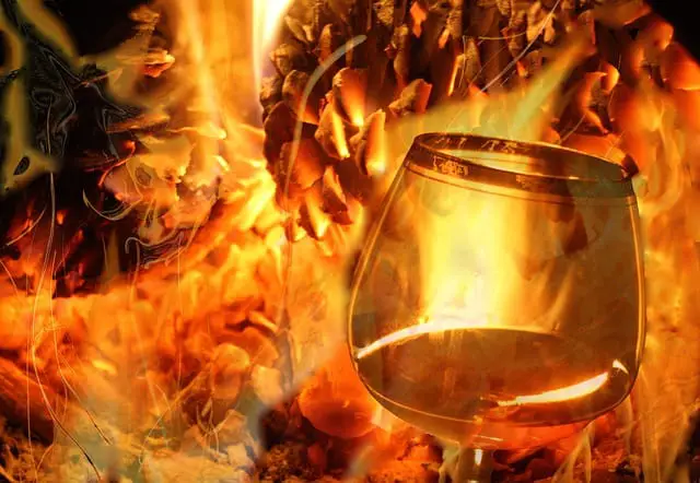 A whiskey glass in a fiery blaze
