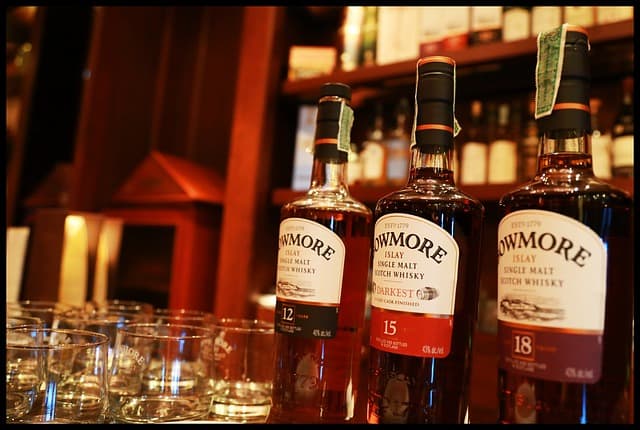 12 year 15 year and 18 year old Bowmore Whisky lined up in a row