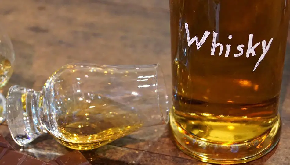 A knocked over whiskey glass