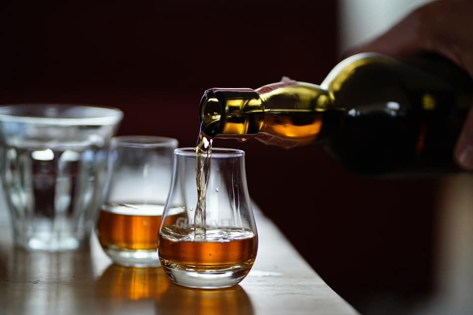 Whiskey being poured into a glass