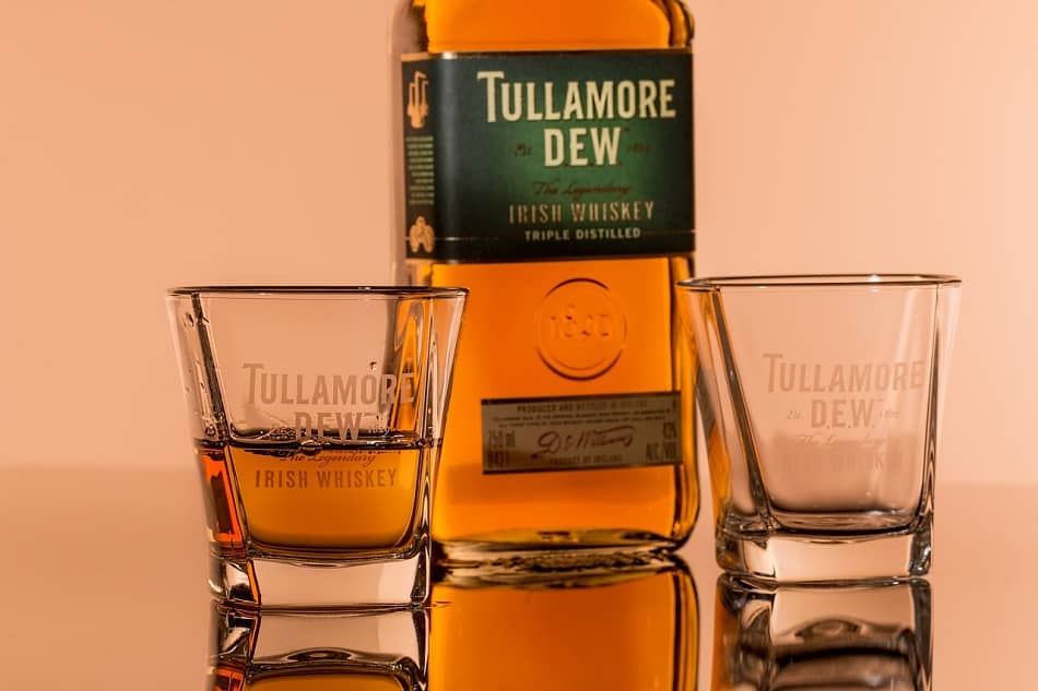 Two glasses of whiskey and a bottle of Tullamore DEW