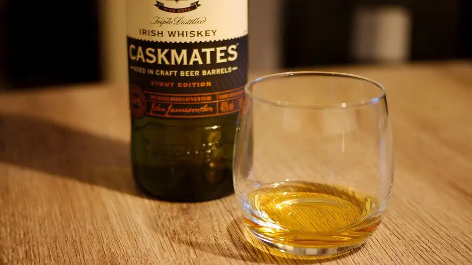 Bottle of Jameson Caskmates Stout Edition and a glass of whiskey