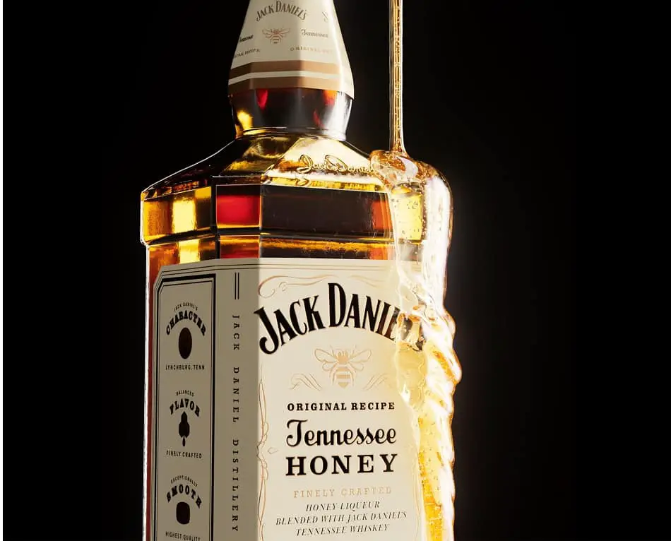 Honey drizzling on a bottle of Jack Daniel’s Tennessee Honey