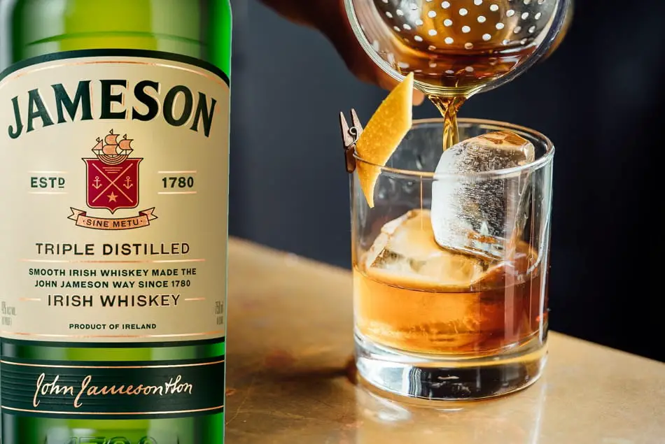 A bottle of Jameson Irish Whiskey and a cocktail