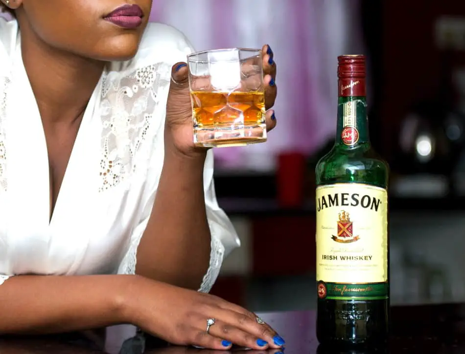 A woman drinking Jameson Irish Whiskey