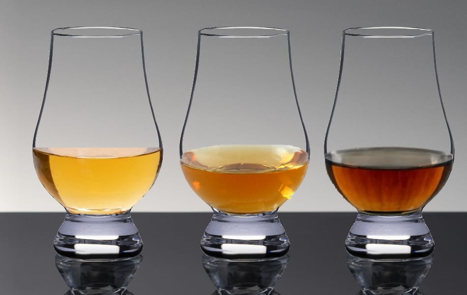 3 Glencairns with different colored whiskeys