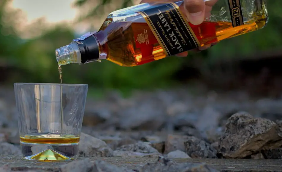 Johnny Walker Black Label being poured into a glass