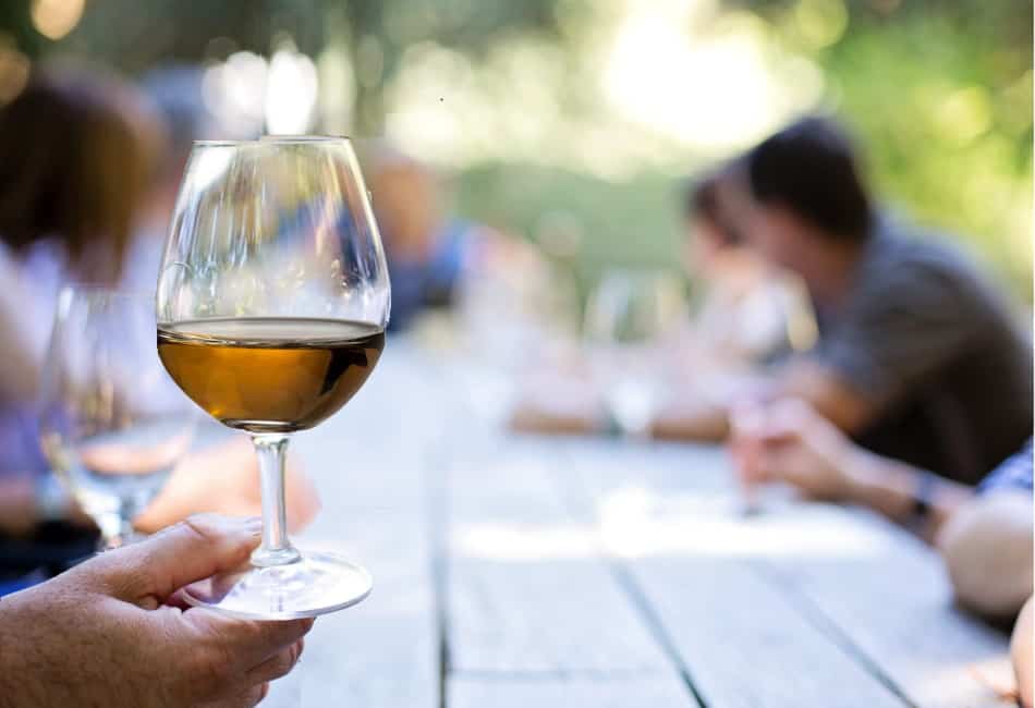 Whiskey nosing glass being held by the base