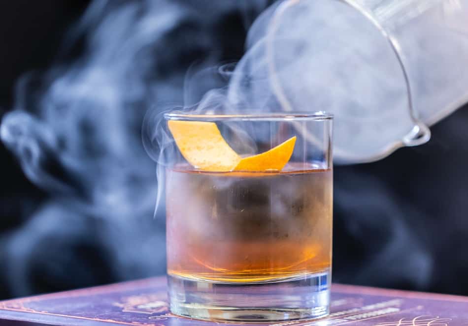 A smoking whiskey glass