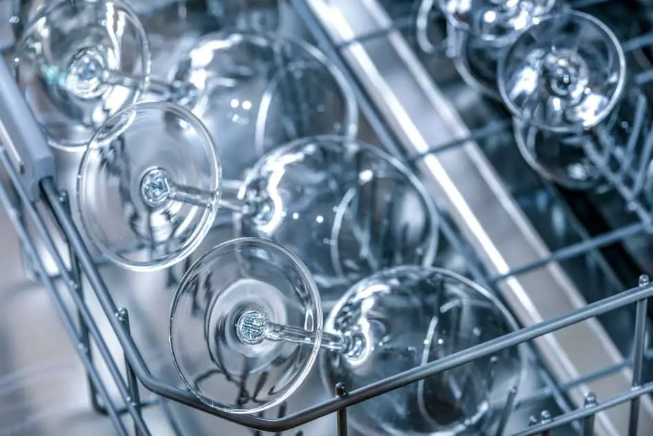 Whiskey glasses lying on a dishwasher rack