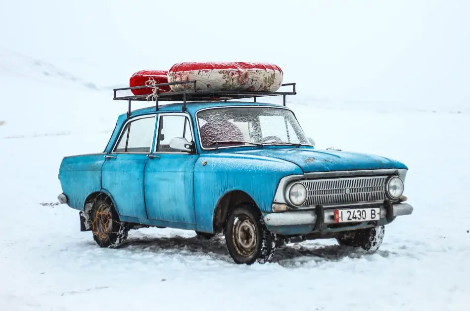 A car driving in the snow